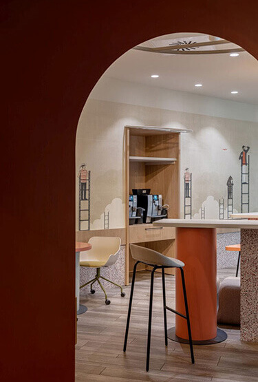 Stylish café area with high tables, high stools and colourful chairs for the kitchen.