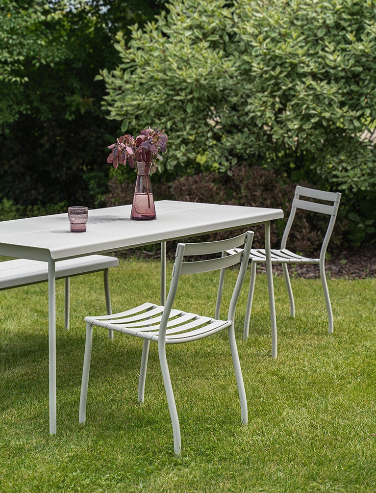A set of white metal oudoor furniture Flaner in a garden