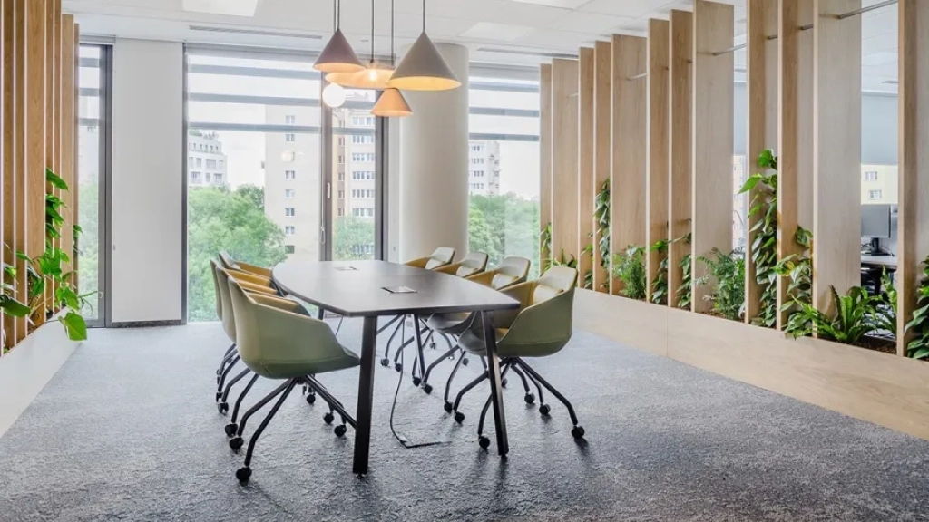 Black table with mediaboxes in a conference room for 8 people