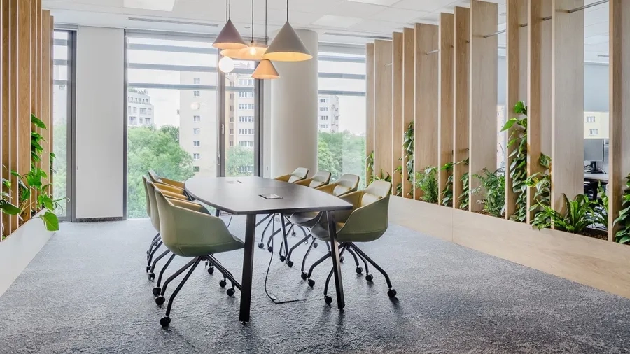 Black table with mediaboxes in a conference room for 8 people