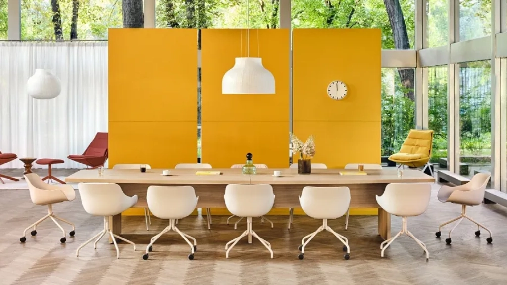 Large wooden conference table prepared for 12 persons