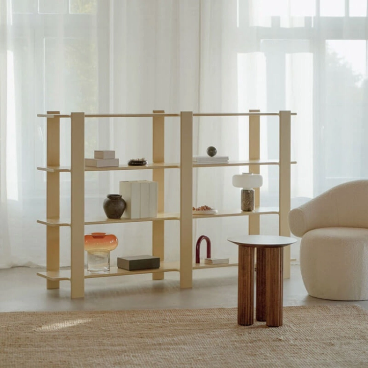 Open office bookcase with shelves for books and decorations in a bright office interior