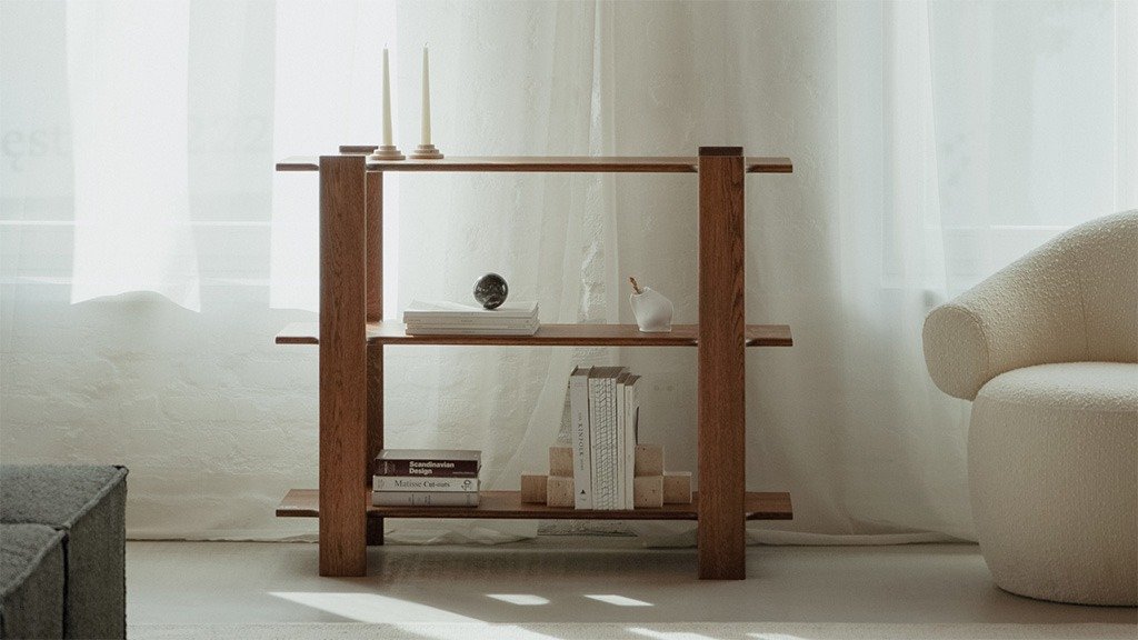 Wooden bookcase with open shelves for storing books and decorative items